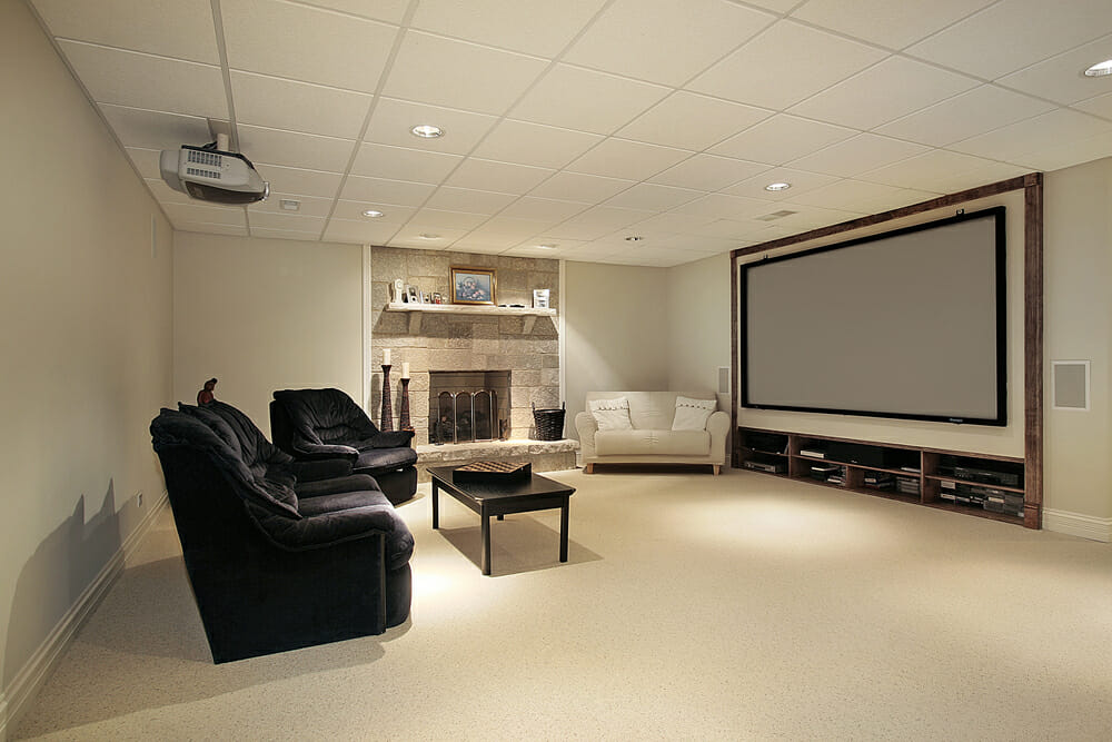 Lower level basement with stone fireplace and large screen television
